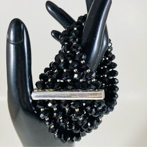 Stunning jet black 6 row crystal stretch bracelet with silver bar embellishment